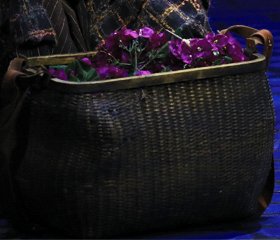 Eliza's flower basket of violets. Photo by Joan Marcus.