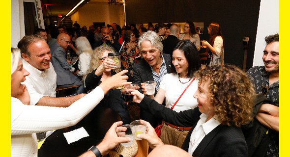A celebratory cheers at the opening night party. Photo by Chasi Annexy.